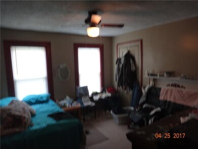 Second floor Bedroom with decorative fireplace.