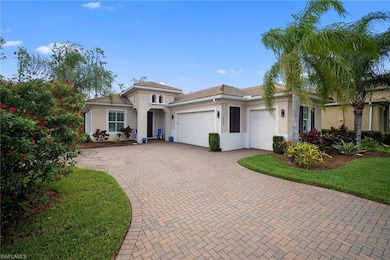Mediterranean / spanish-style home with an attached garage, stucco siding, decorative driveway, and a tiled roof