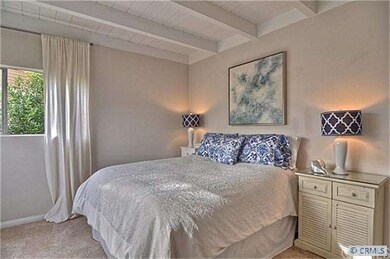 Bedroom with wood beam ceilings