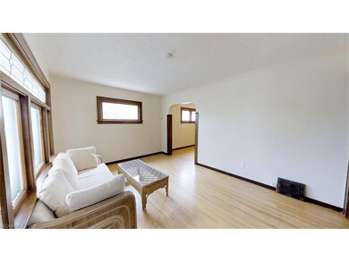 Large living room with original refinished hardwoo