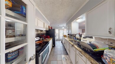 Kitchen with appliances with stainless steel finis