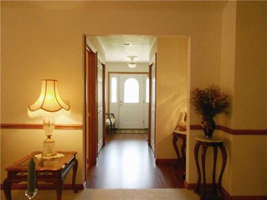 Entry/Foyer. WOOD LAMINATE FLOORING IN FOYER WITH 