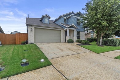 View of front of property with brick siding, driv