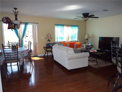 Dining/Living area with upgraded laminated wood fl