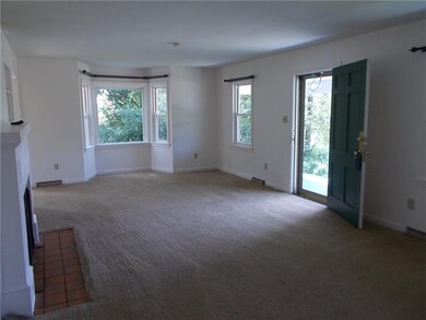 The living room is very large. There is a bay wind