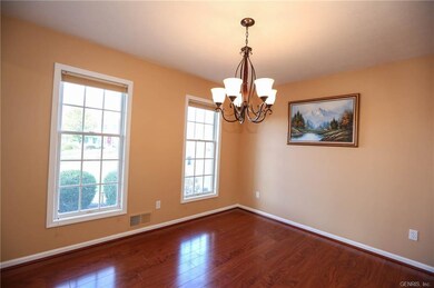Cherry laminate flooring in formal dining