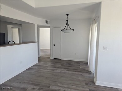 Dining area with Vinyl wood plank floors, balcony
