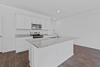 Kitchen with a sink, stainless steel appliances, 