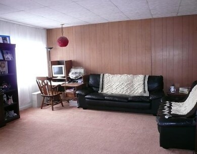 Living Room. The living room in the 2nd floor unit