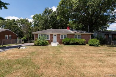 Ranch-style house with a front lawn