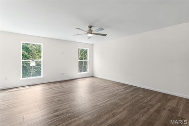 Unfurnished room featuring wood finished floors and ceiling fan