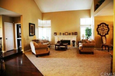 Formal living room with new carpet and fireplace