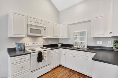 Stainless sink, electric range, micro-draft, dishwasher, frig convey.