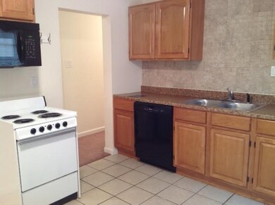 Kitchen looking to hall where bedroom and bath are
