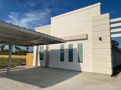 Rear view of house featuring a patio area