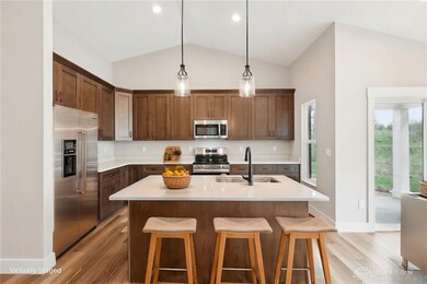 The upgraded high-end kitchen offers a 6ft island, quartz countertops, 42