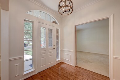 Lovely foyer gleaming hardwood floors and updated