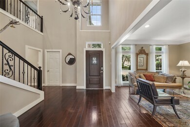 Gorgeous Entry with Wood Flooring, Designer Light
