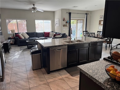 Kitchen with stainless steel dishwasher, an island
