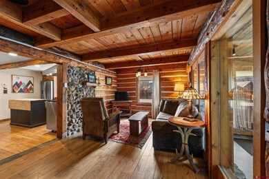 One of two living rooms on the first floor. This cozy space is open to the dining area.