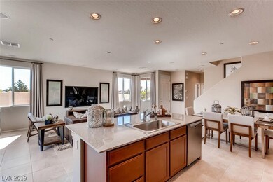 Photo is of model home kitchen and great room