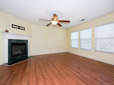 Living room with fireplace and large windows