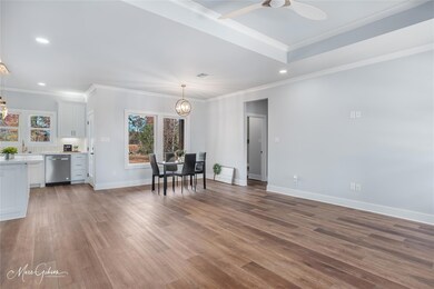 Unfurnished dining area featuring crown molding, h