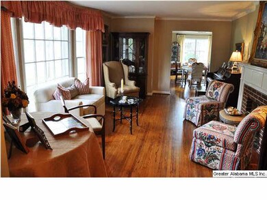Hardwoods and large window in Living Room