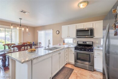 Kitchen featuring stainless steel appliances, a pe
