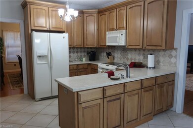 Kitchen - solid surface counters & tile backsplash