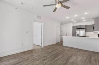 Unfurnished living room featuring recessed lighti