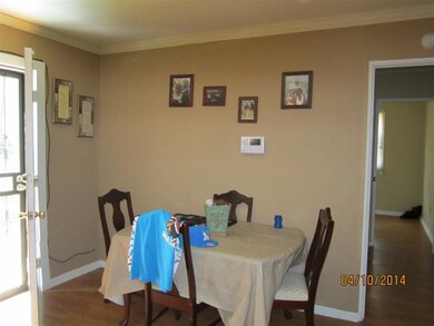 Living room/dining room combo with wood laminate f