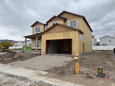 Unfinished property with a porch, a garage, and driveway
