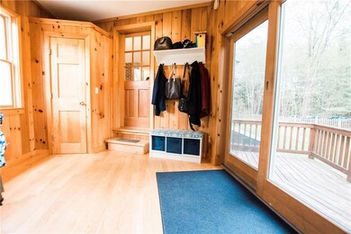 This spacious mudroom can only be...