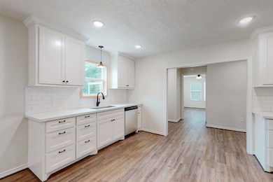 Cute country kitchen with a large farm house sink and window above!