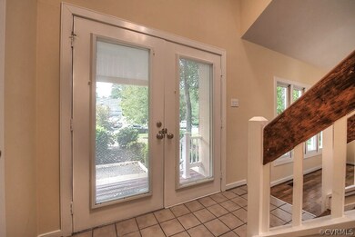 Double door entrance into spacious foyer