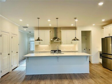 Kitchen featuring stainless steel appliances, ligh