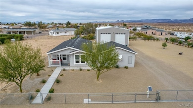 View of front of house with a fenced front yard, a