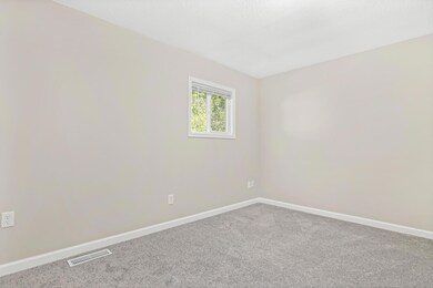 The primary bedroom has new carpet and new paint.  All the trim has been updated as well.