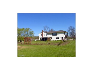 Rear of home with large perennial gardens- beautif