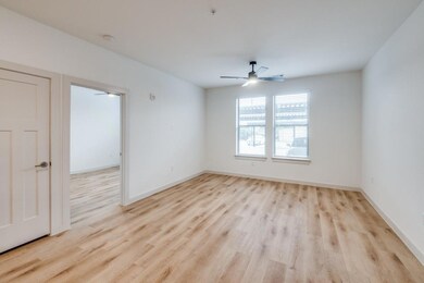 Empty room featuring light wood finished floors, b