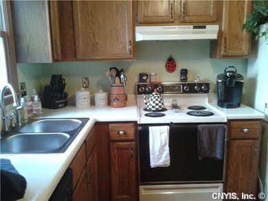 Kitchen. new kitchen sink and garbage disposal.. seller is leaving stove and refrigerator