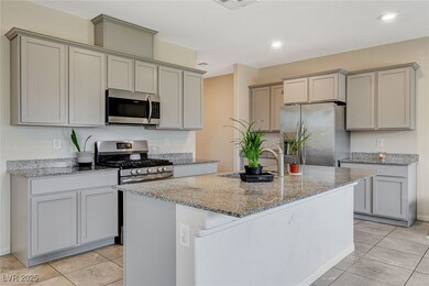 Kitchen with stainless steel appliances, a sink, g