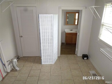VIEW OF LARGE UTILTIY ROOM AND INTO 2ND BATHROOM