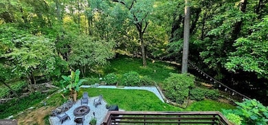 Just beyond the deck is a firepit for gatherings and smores all year around.