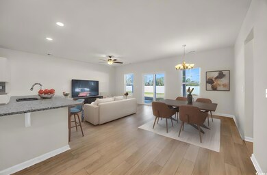 Dining room with baseboards, light wood finished f
