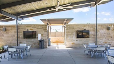 View of patio with ceiling fan