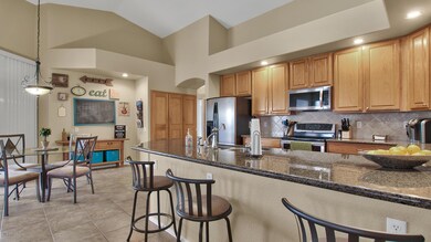 Kitchen opens to patio and family room
