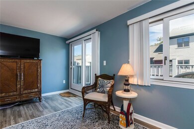 Living room, sliding door to deck overlooking Bric