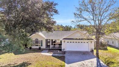 Single story home featuring a front lawn, a porch,